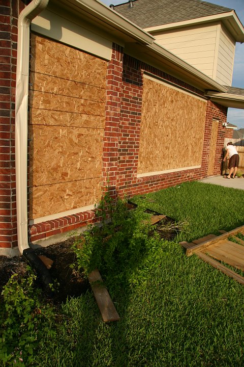 CRW_8402_JFR.JPG - You can see a dent in our downspout, a peice of the fence hit it; sure glad we boarded up the back windows!